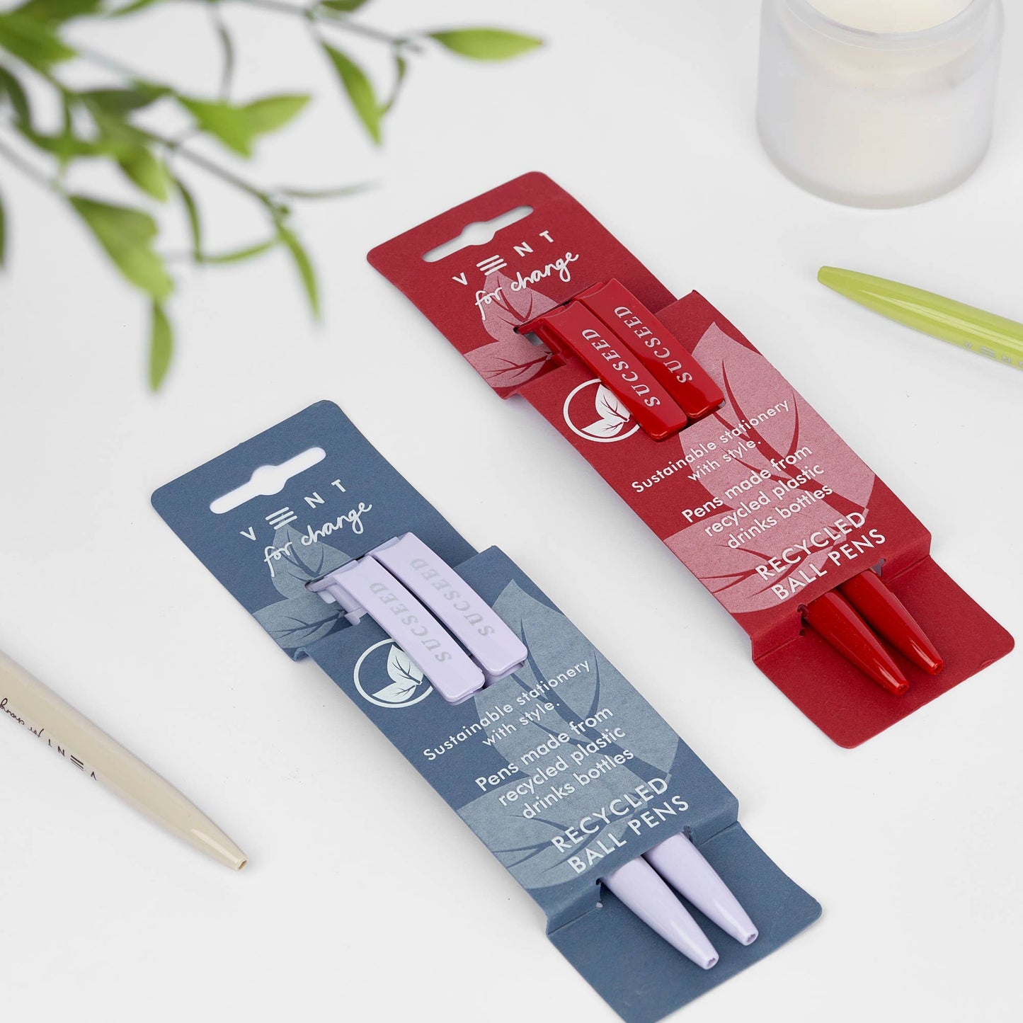 2 sets of recycled pens in red SUCSEED Cherry sleeve and blue SUCSEED Lavendersleeve made from single-use plastic bottles