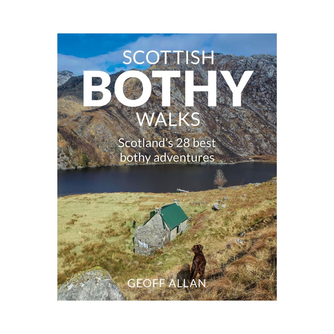 The cover of the book 'Scottish Bothy Walks' by Geoff Allan featuring a scenic view of a bothy by a loch with mountains in the background and a dog sitting in the foreground.