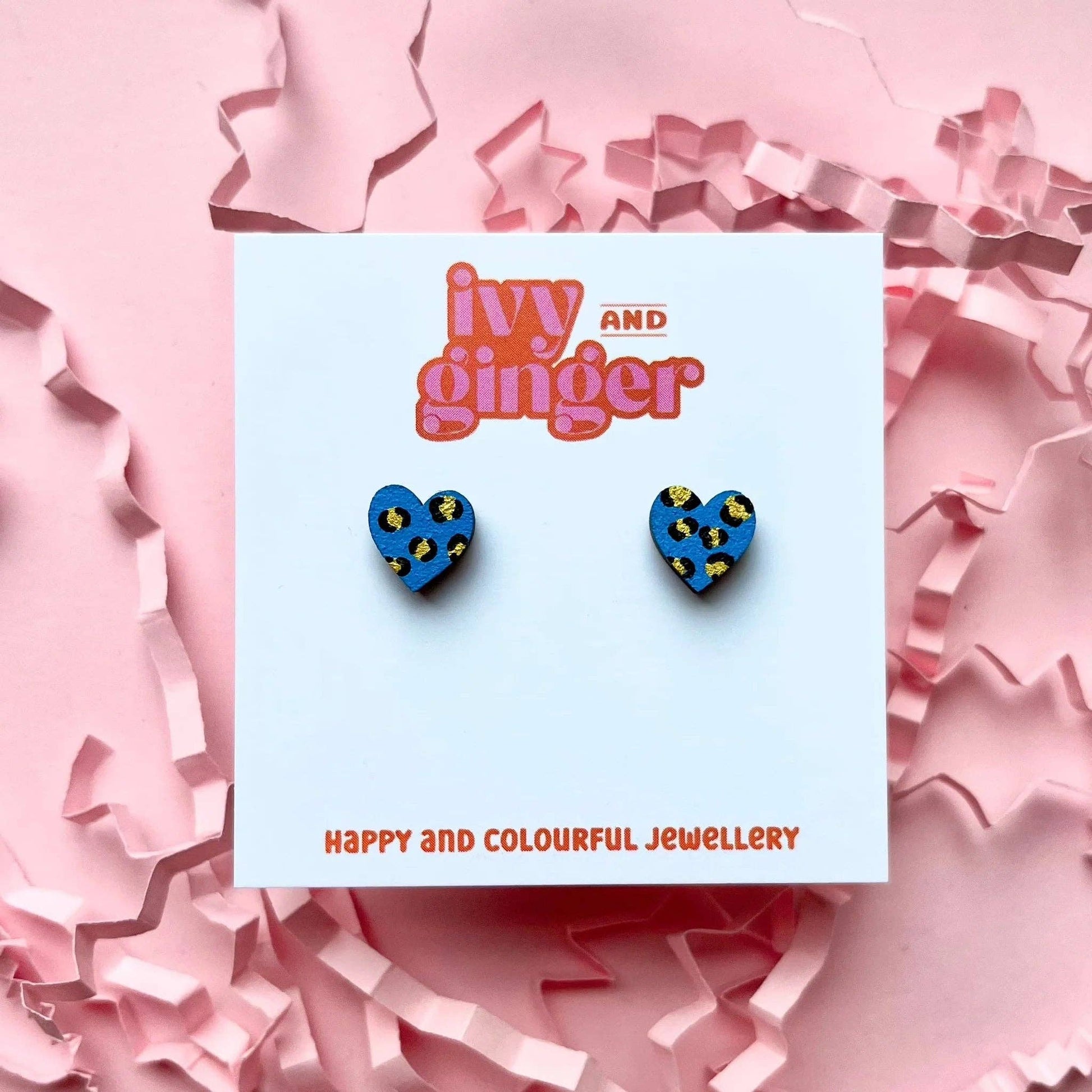 Hand painted bright blue and gold heart stud earrings made from FSC wood with surgical steel posts, 10mm in size, lightweight and gift-ready.