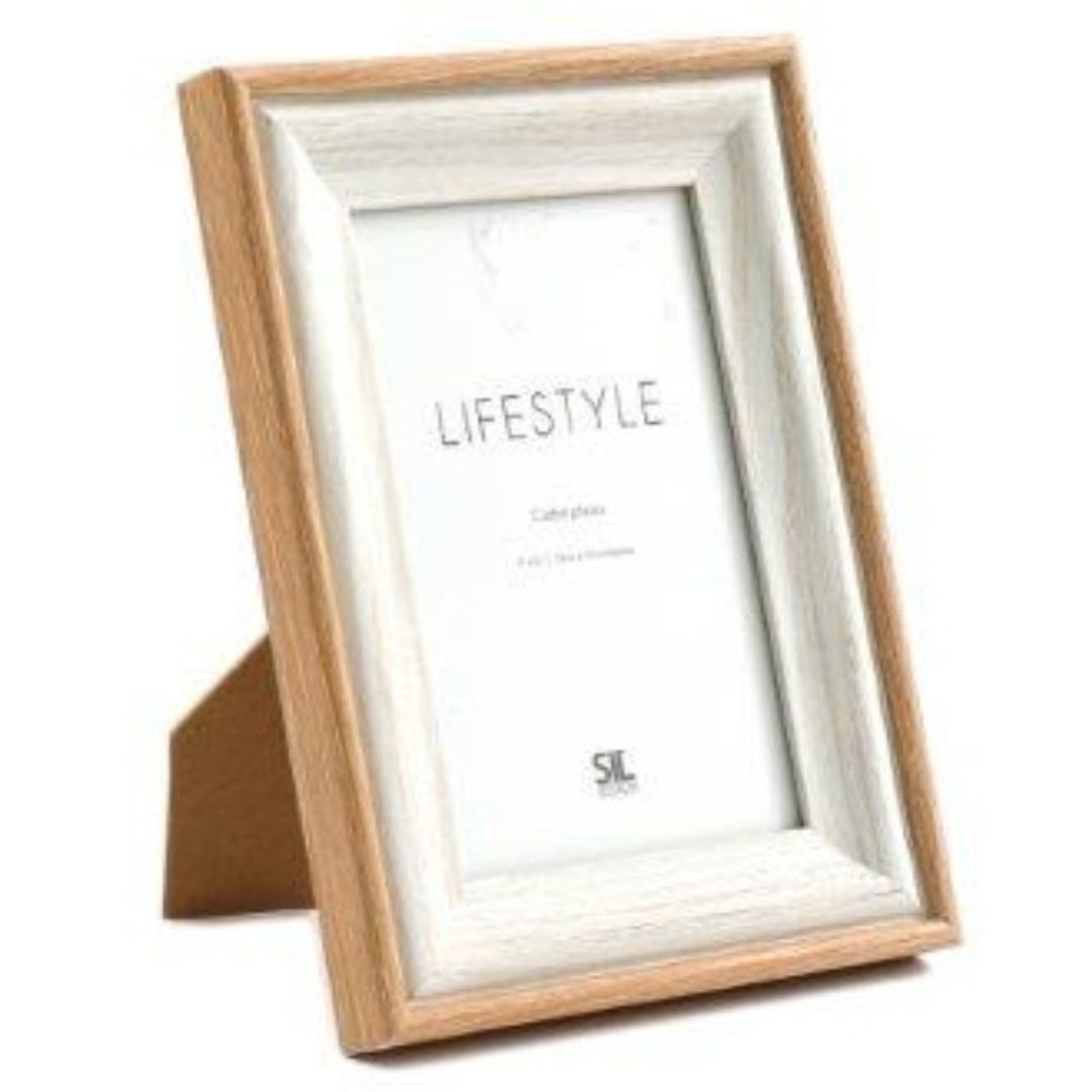 A wooden photo frame with a visible, textured natural edge, finished in a neutral colour palette