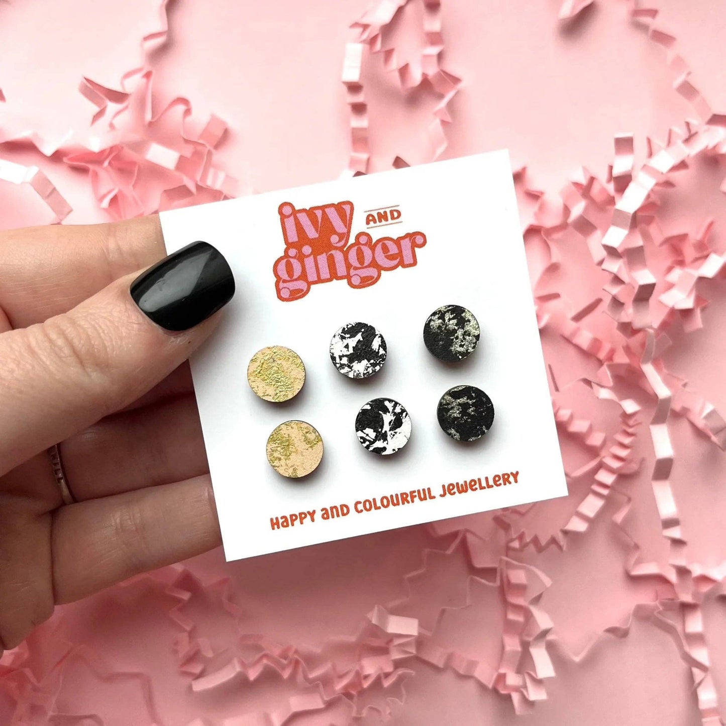 Black, cream, and gold hand-painted wooden stud earrings, 10mm FSC certified, with surgical steel backs for sensitive ears.