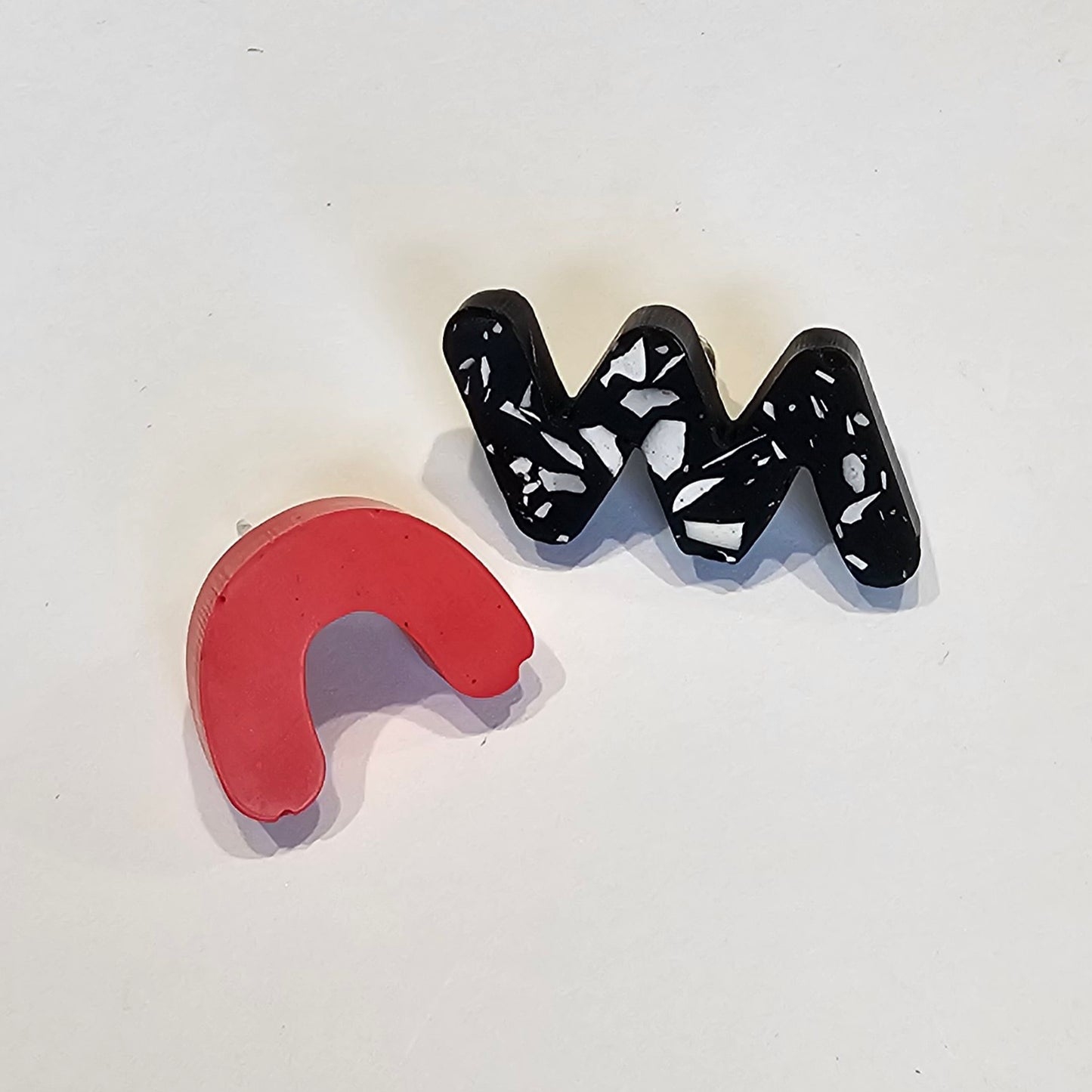 MIS-MATCHED STUDS PAIR