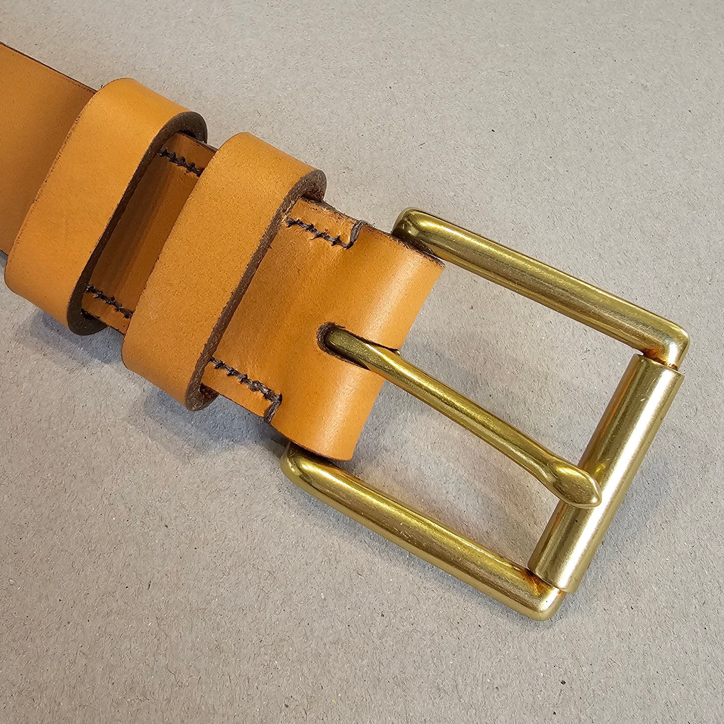 Handcrafted Sedgwick vegetable-tanned leather belt with brass buckle in branded drawstring bag