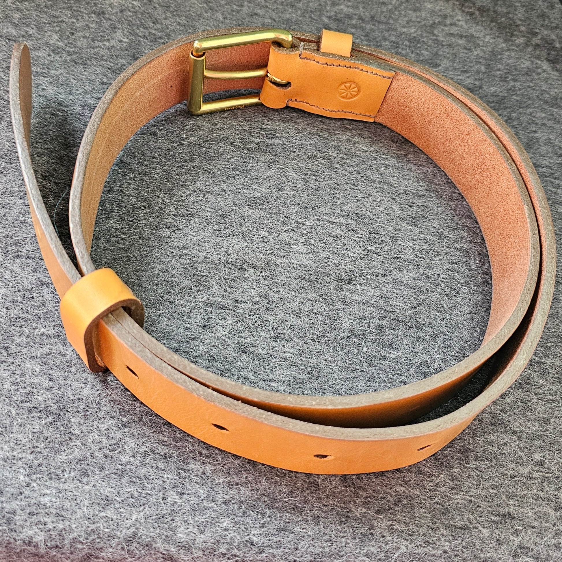 Handcrafted Sedgwick vegetable-tanned leather belt with brass buckle in branded drawstring bag