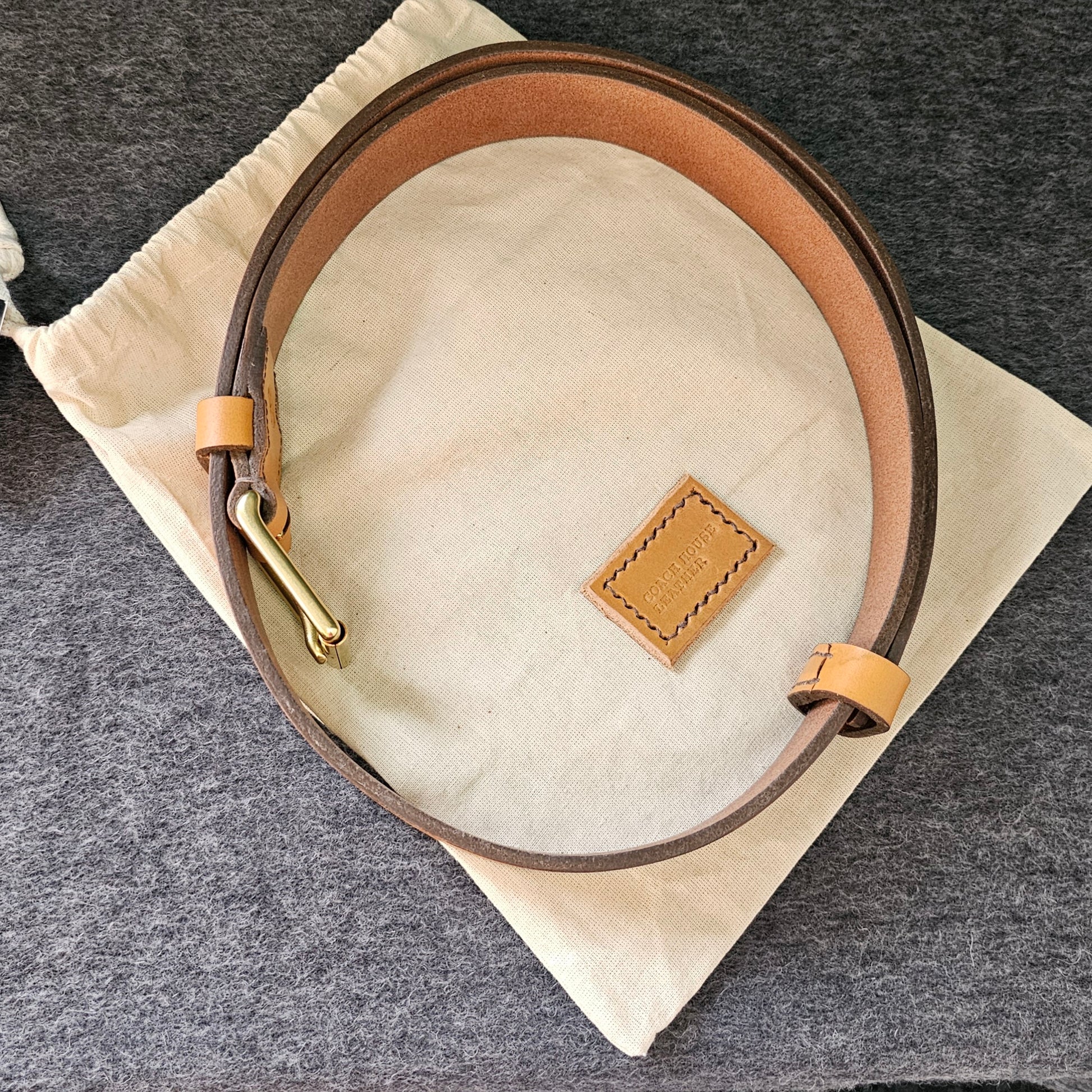 Handcrafted Sedgwick vegetable-tanned leather belt with brass buckle in branded drawstring bag