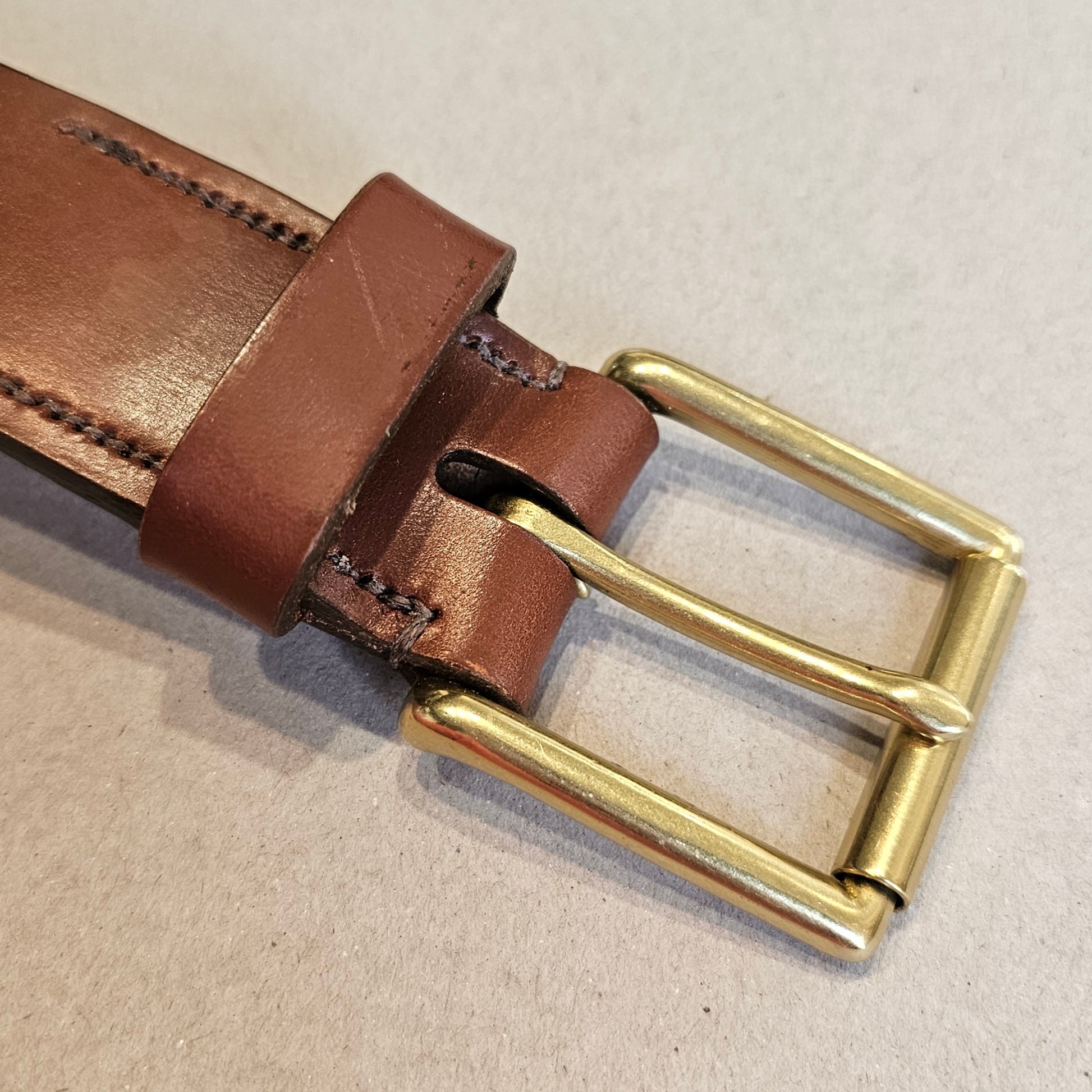 Handcrafted Sedgwick vegetable-tanned leather belt with brass buckle in branded drawstring bag