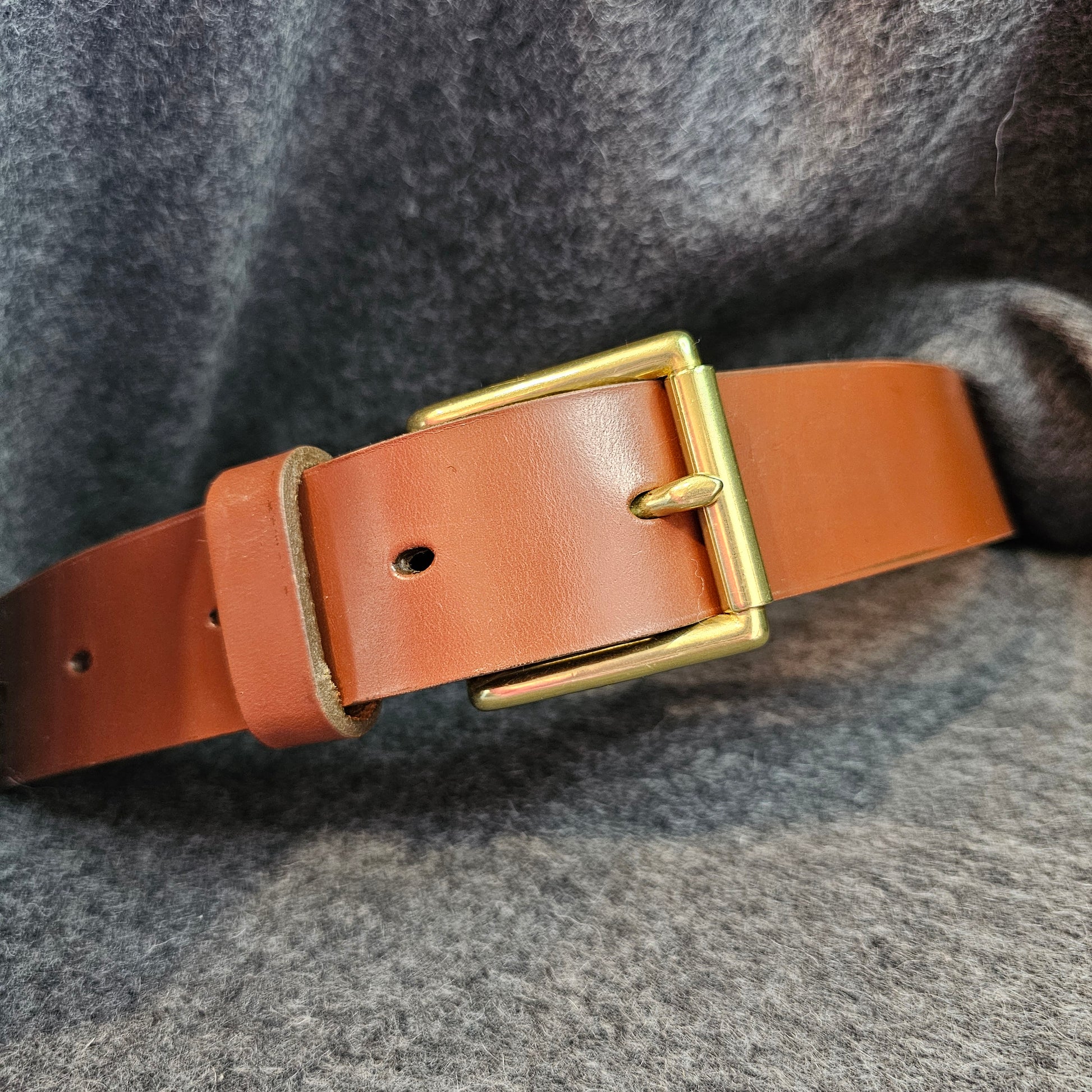 Handcrafted Sedgwick vegetable-tanned leather belt with brass buckle in branded drawstring bag