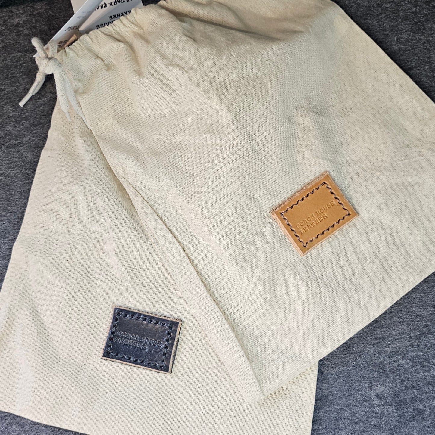 Handcrafted Sedgwick vegetable-tanned leather belt with brass buckle in branded drawstring bag