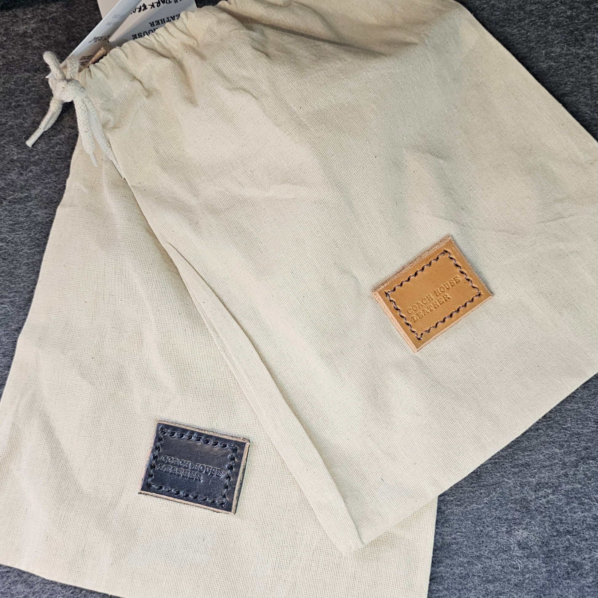 Handcrafted Sedgwick vegetable-tanned leather belt with brass buckle in branded drawstring bag