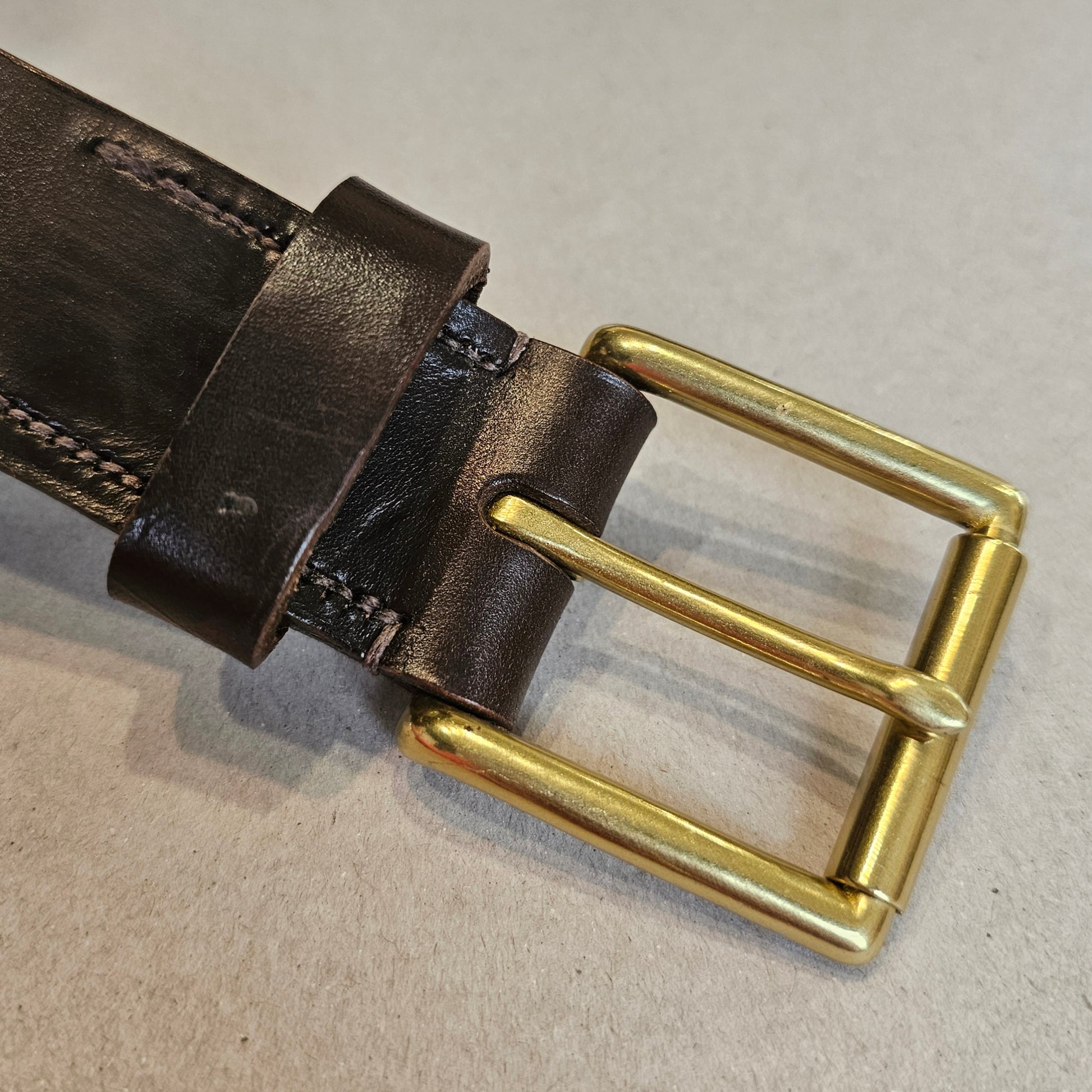 Handcrafted Sedgwick vegetable-tanned leather belt with brass buckle in branded drawstring bag