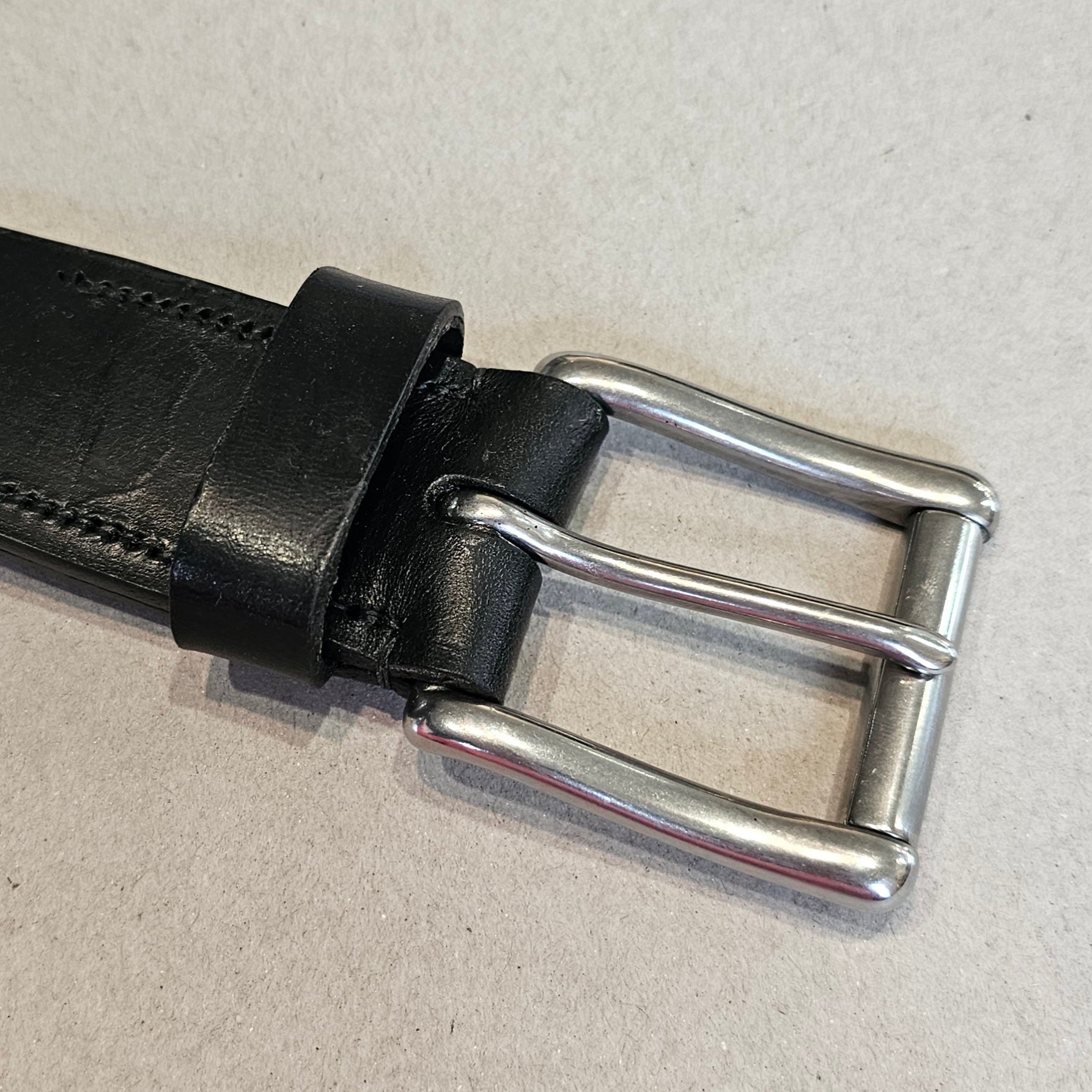 Handcrafted Sedgwick vegetable-tanned leather belt with brass buckle in branded drawstring bag