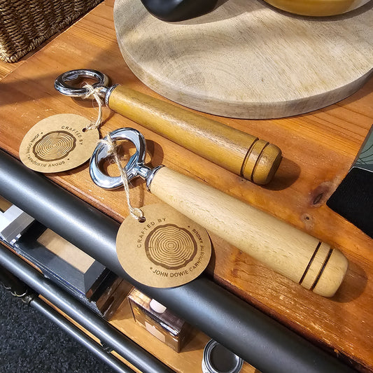 Hand turned wooden bottle openers with chrome tops, made in Carnoustie.