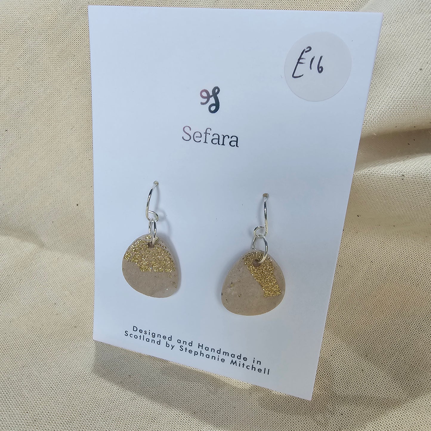 Pair of handmade polymer clay hook earrings – lightweight cream and gold leaf design by Sefara Jewellery