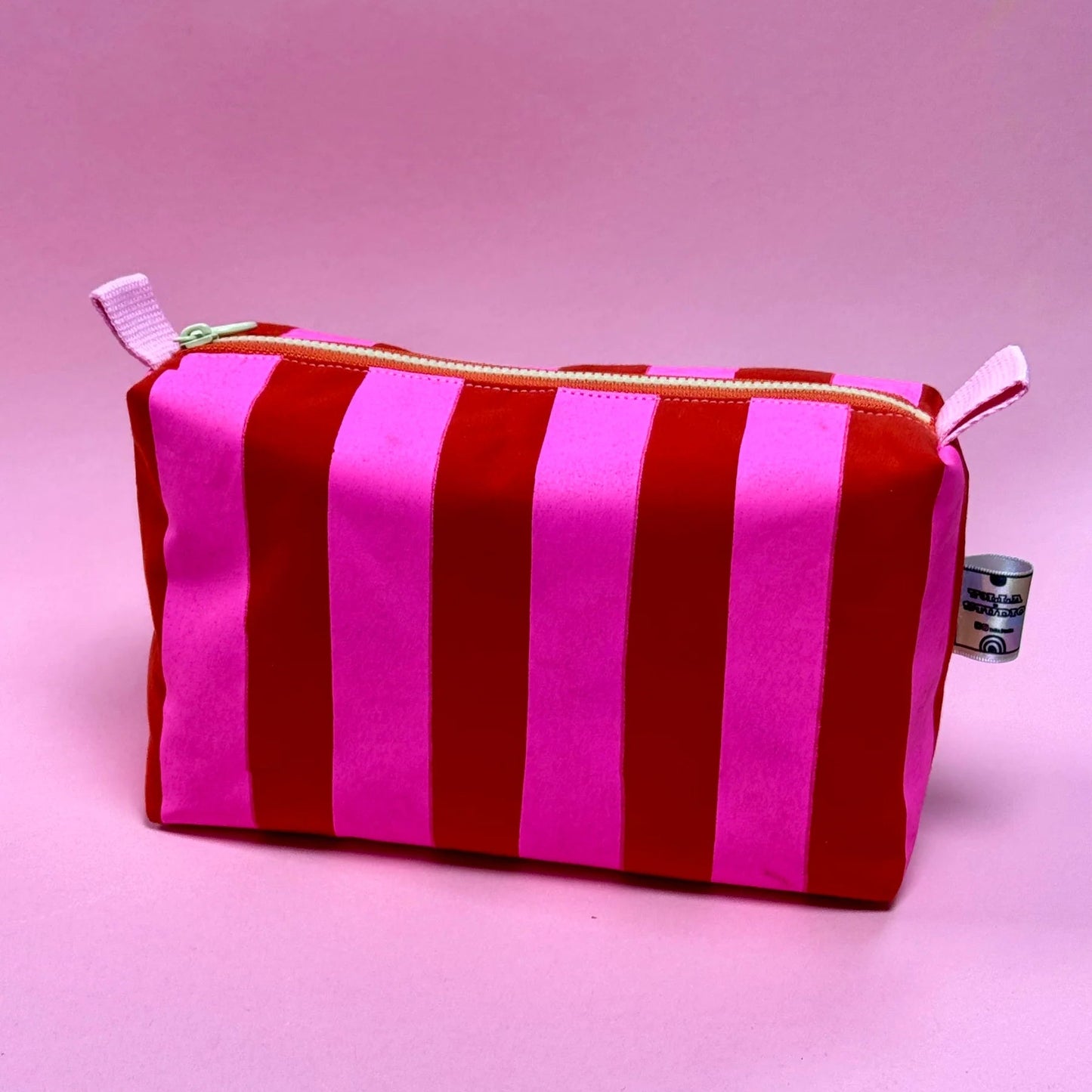 Handmade boxy cosmetic pouch made in Dundee from water-resistant wax cotton, screen printed and fully lined for makeup and toiletries.