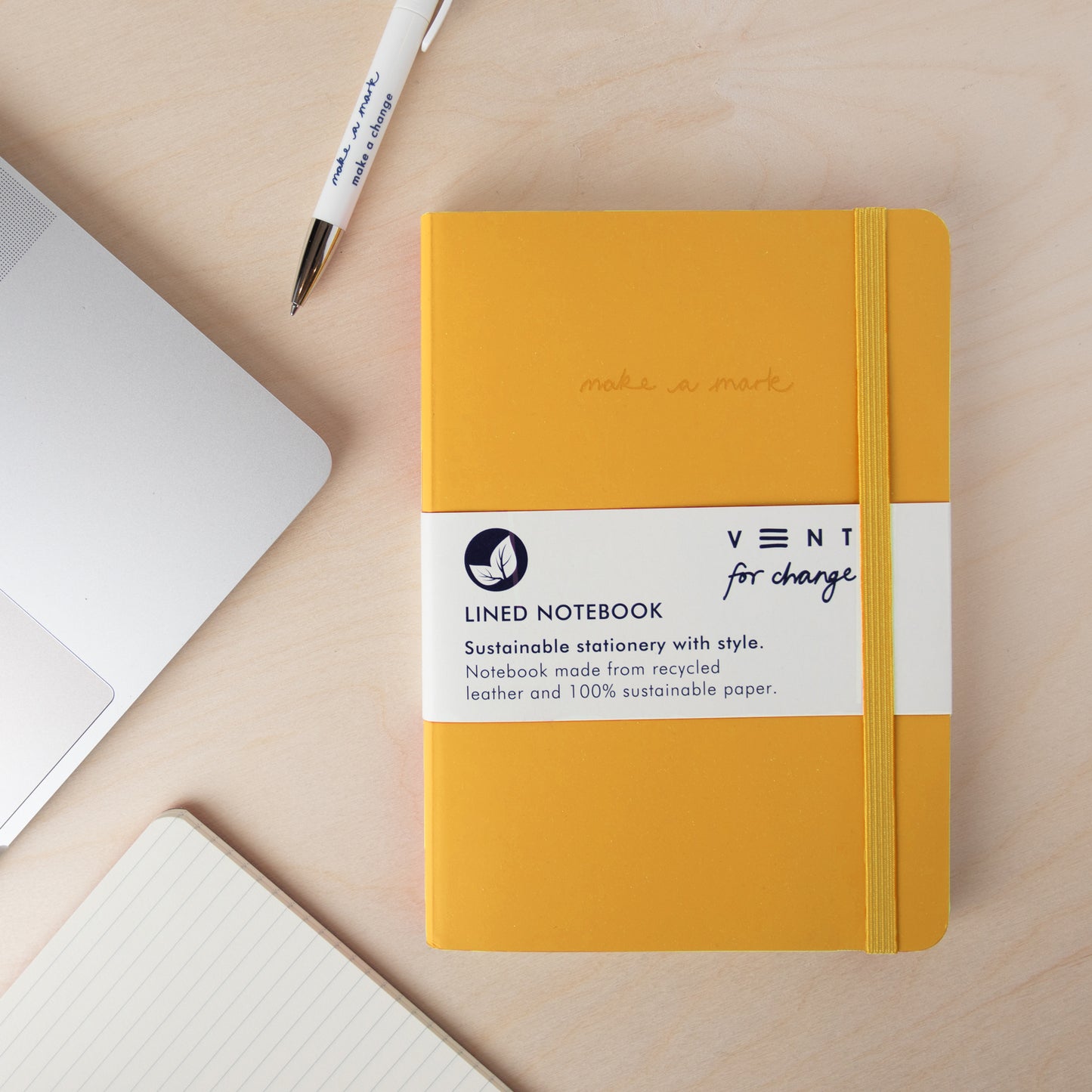 A5 recycled leather notebook with Make a Mark debossed cover, elastic closure, and sustainable lined pages - yellow