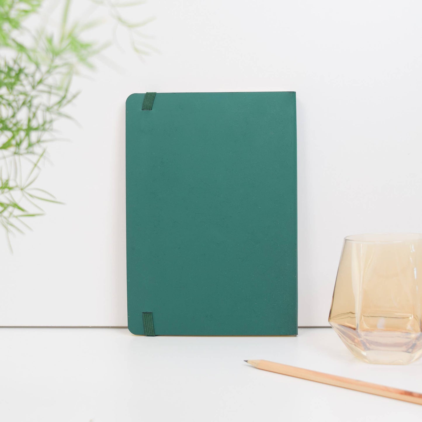 A6 recycled leather pocket notebook with elastic closure in green