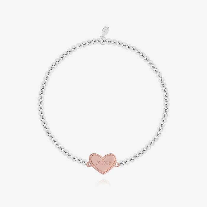 A silver plated stretch beaded bracelet with a rose-gold plated heart charm