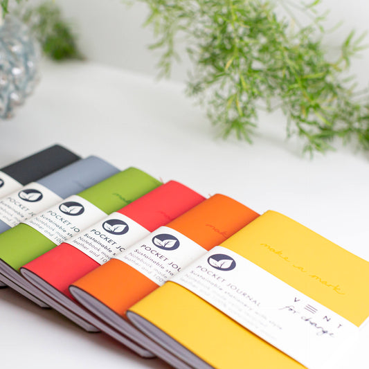 Slim pocket journal with recycled leather cover, Make a Mark design, and FSC-certified lined and plain pages