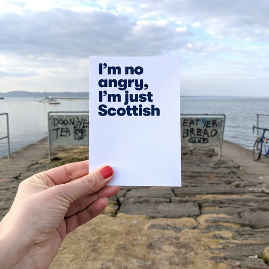 A vertically folded greeting card with the Scottish phrase "I'm No Angry I'm Just Scottish" in a bold, hand-designed typography style.