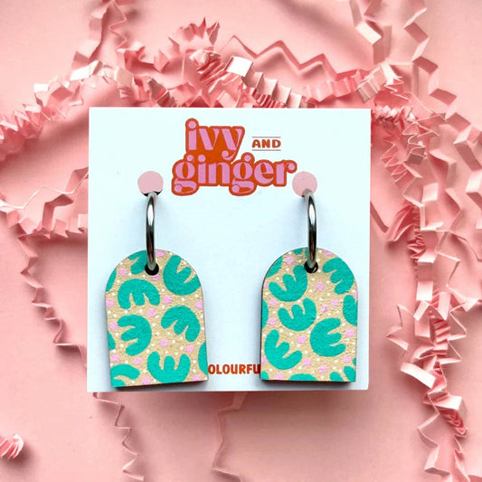 Hand-painted dangle hoop earrings with a tropical retro print