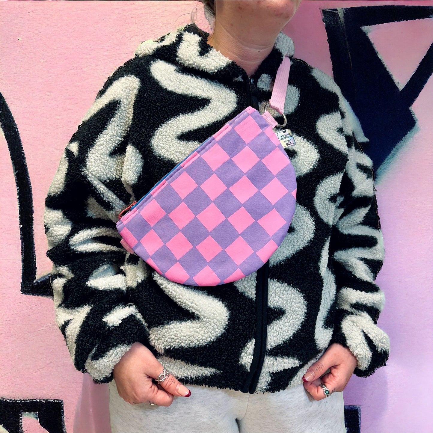 Handprinted crossbody bag handmade in Dundee from water-resistant wax cotton with padded lining, inner pocket and adjustable strap.