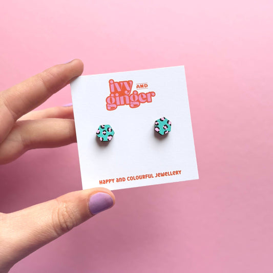 Hand painted green and pink hexagon stud earrings made from FSC wood with surgical steel posts, 10mm in size, lightweight and gift-ready.