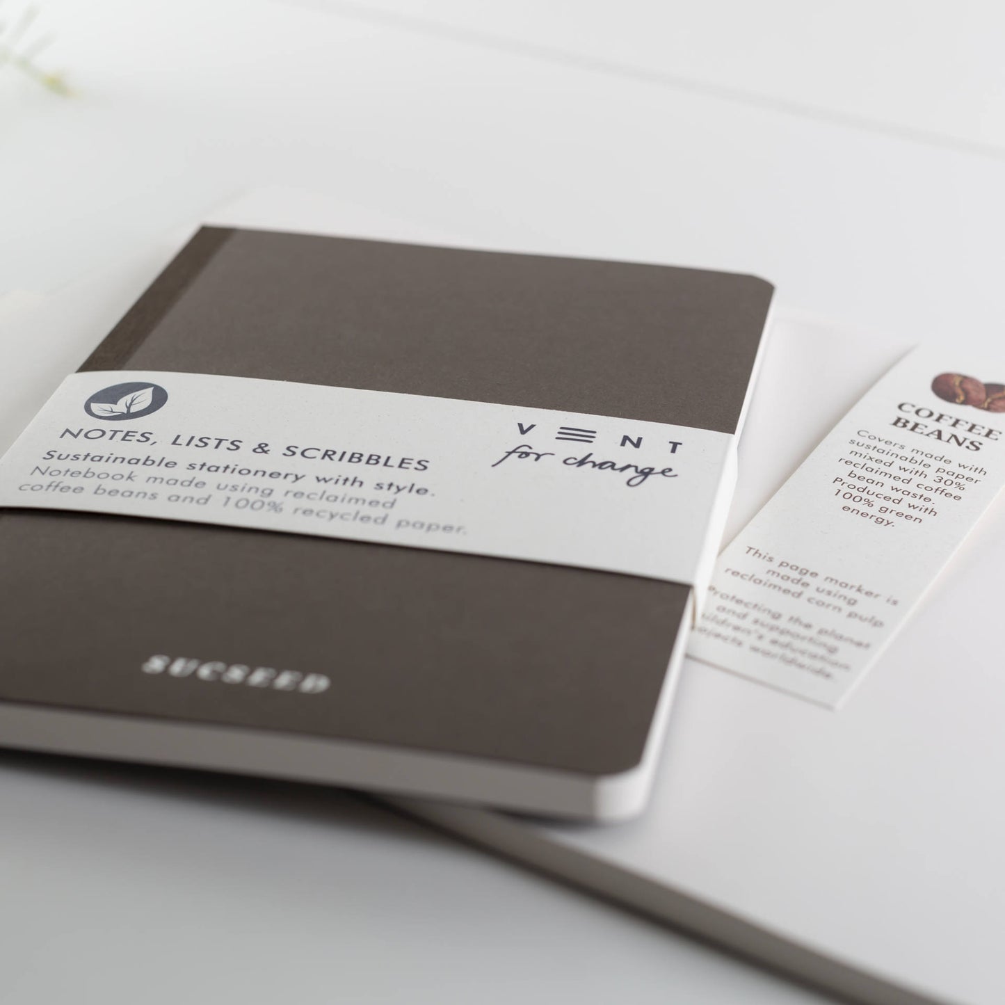 A6 notebook with SUCSEED foil cover, made from coffee waste and recycled paper, with lined, plain and numbered pages
