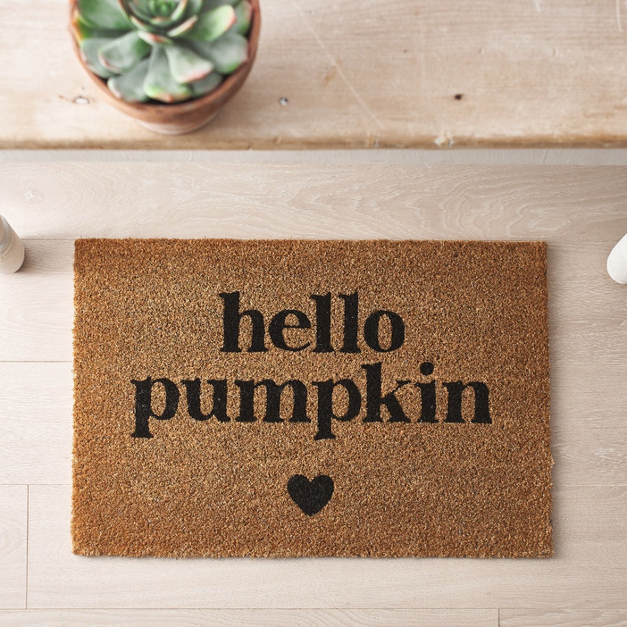 Coir doormat with Hello Pumpkin text and small heart design.