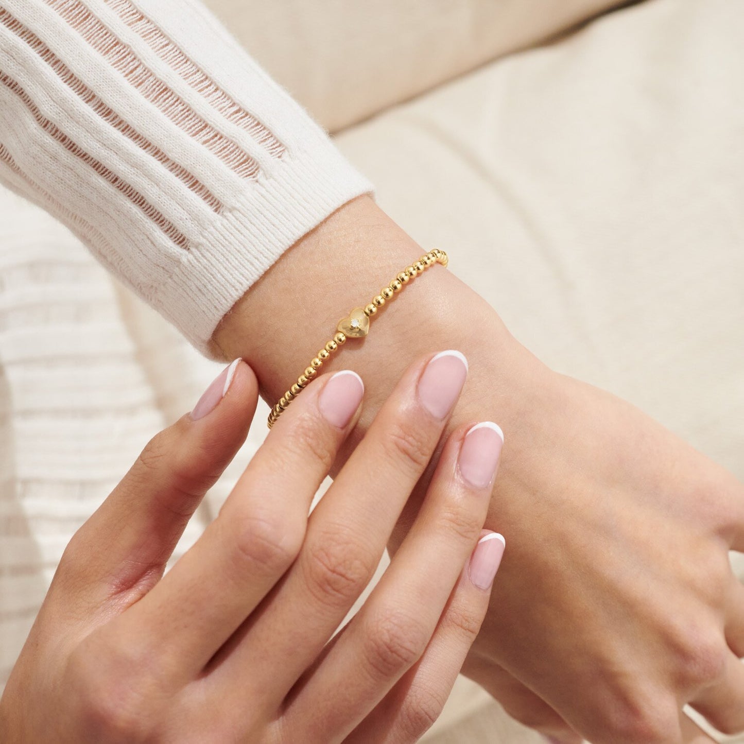 A LITTLE 'HAPPY BIRTHDAY' GOLD BRACELET