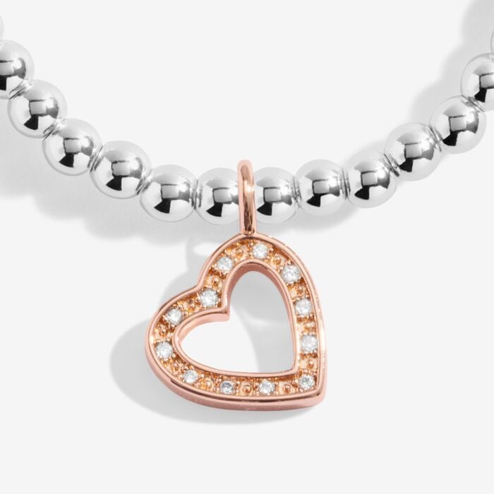 Silver plated stretch beaded bracelet with rose gold and sparkle heart shaped charm