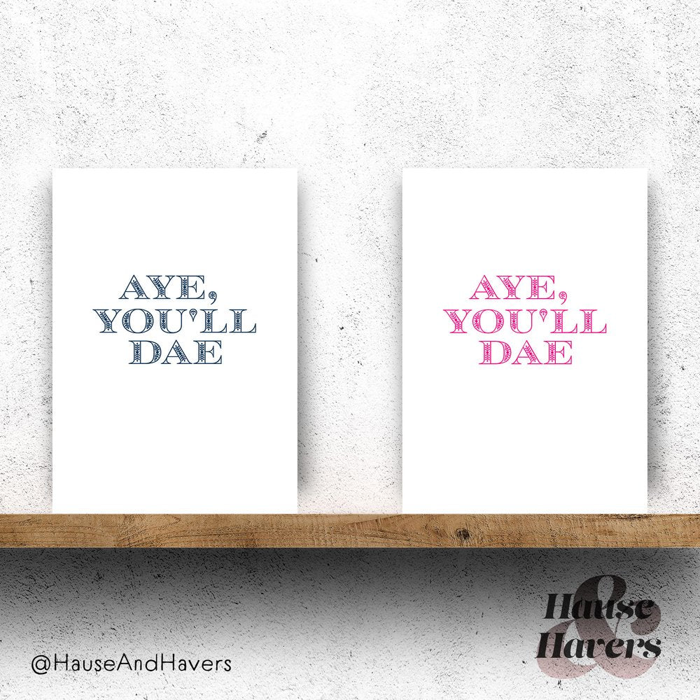 Vertically folded greeting cards with the Scottish phrase "Aye You'll Dae" in modern, hand-designed typography.