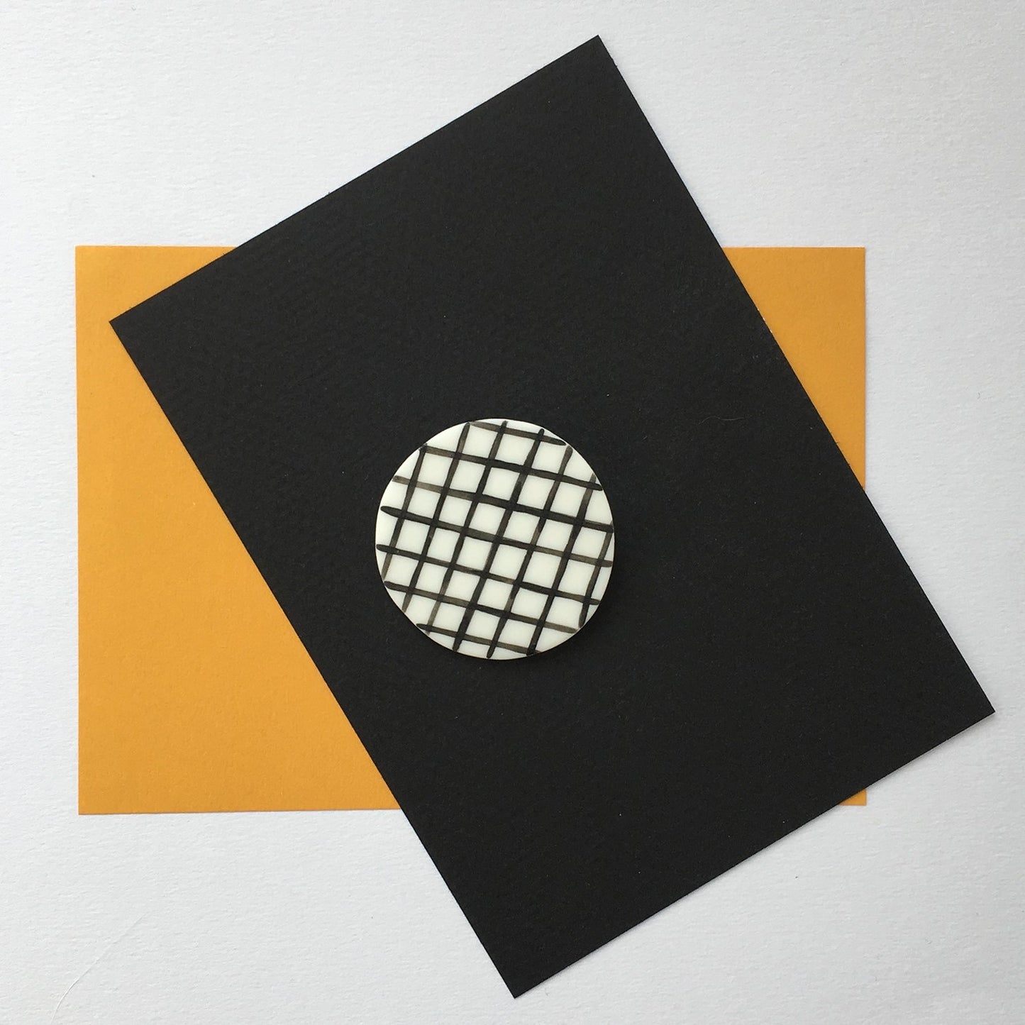 STAPLE BROOCH PIN GRID