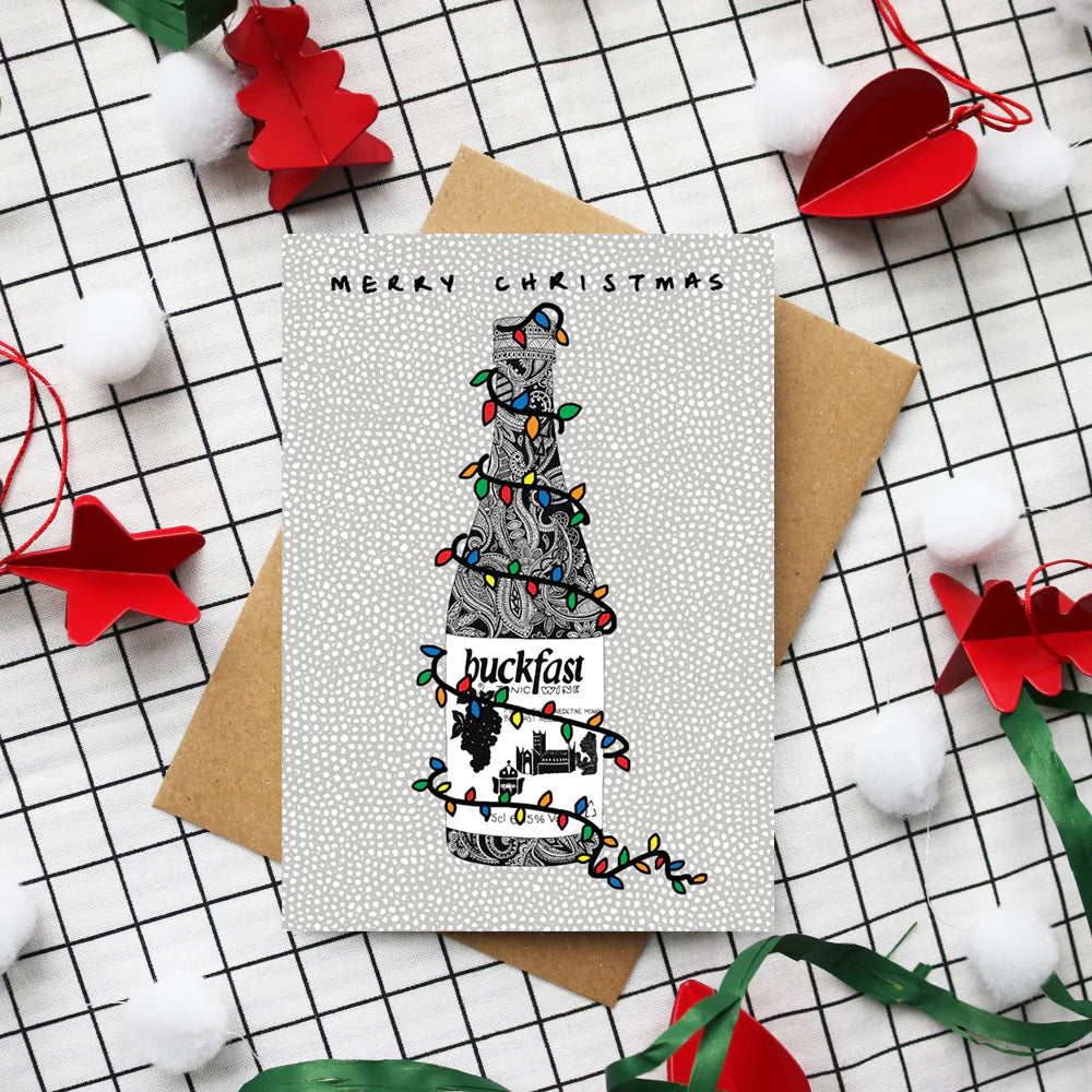 Buckfast Christmas card featuring hand-drawn bottle design by Kilo Papa Studio, printed on recycled paper with Kraft envelope.