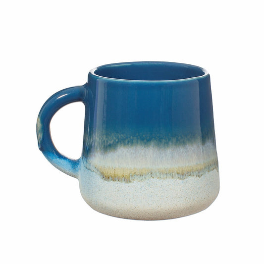 A stoneware mug featuring a blue ombre colour transition achieved with a reactive glaze, approximately 13.5cm wide and 10cm high.
