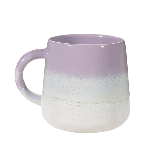 A stoneware mug featuring a lilac ombre colour transition achieved with a reactive glaze, approximately 13.5cm wide and 10cm high.