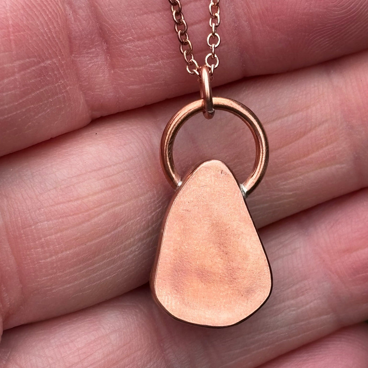Copper bezel set white sea glass necklace by Rowan Berry Jewellery handmade in Carnoustie with locally collected sea glass