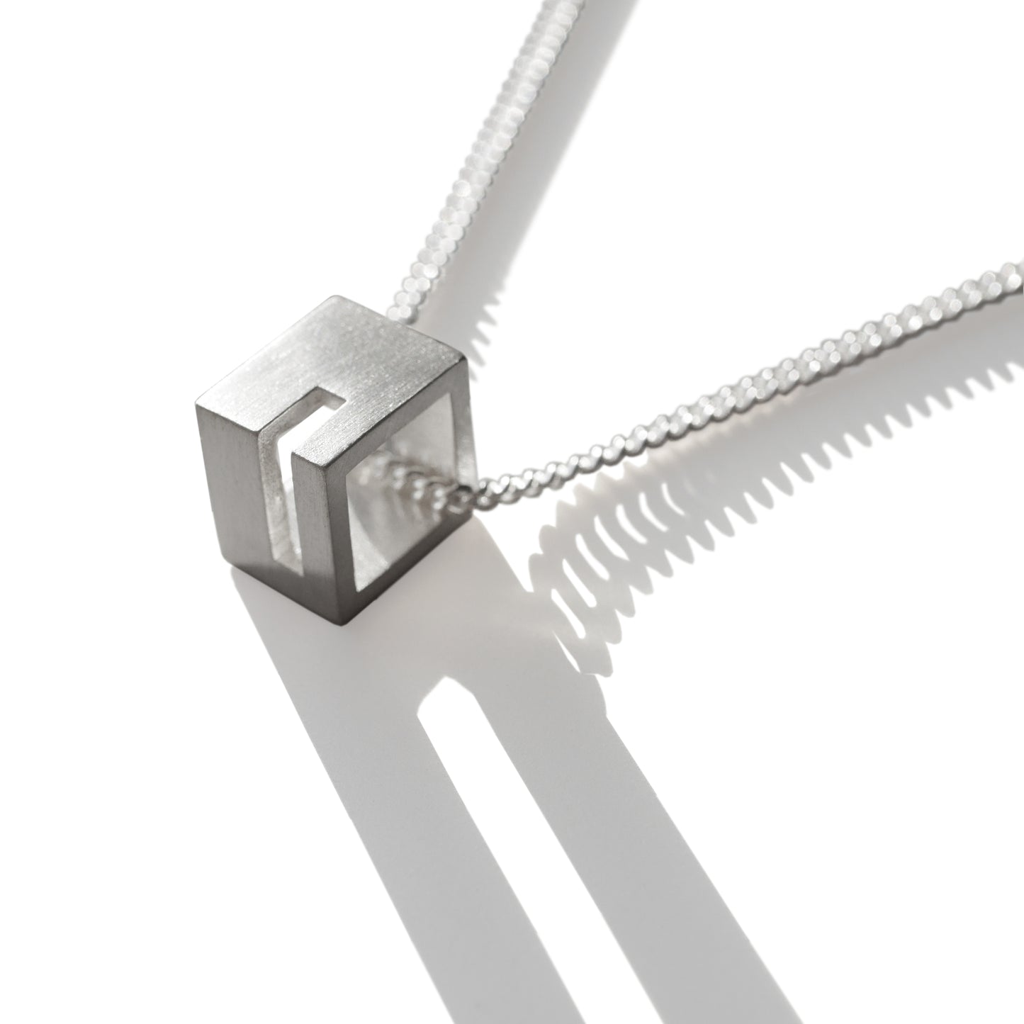 CORNER CUT OUT CUBE PENDANT