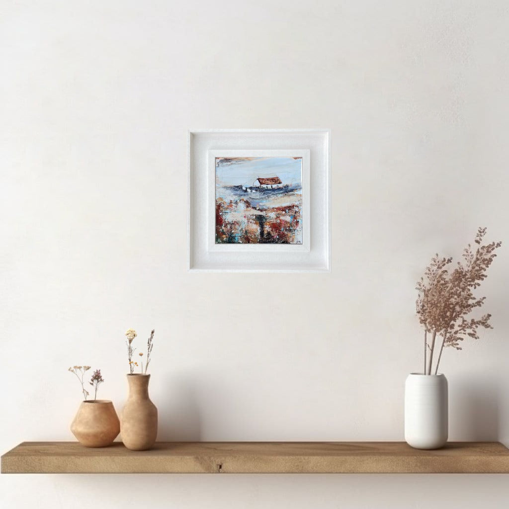 A ceramic tile print of a colourful painting titled 'Easter Cottage', showing a small house nestled in the Scottish Highlands, available mounted on natural slate or framed.
