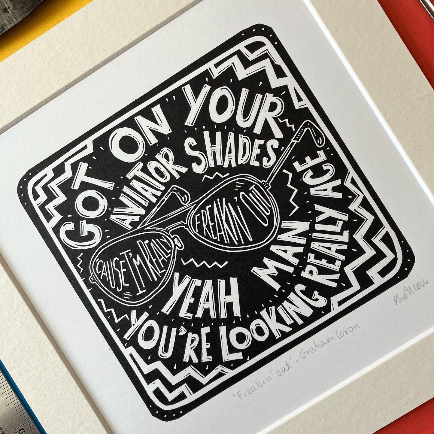 Freakin' Out by Graham Coxon Black and White Lino Print on a colourful background