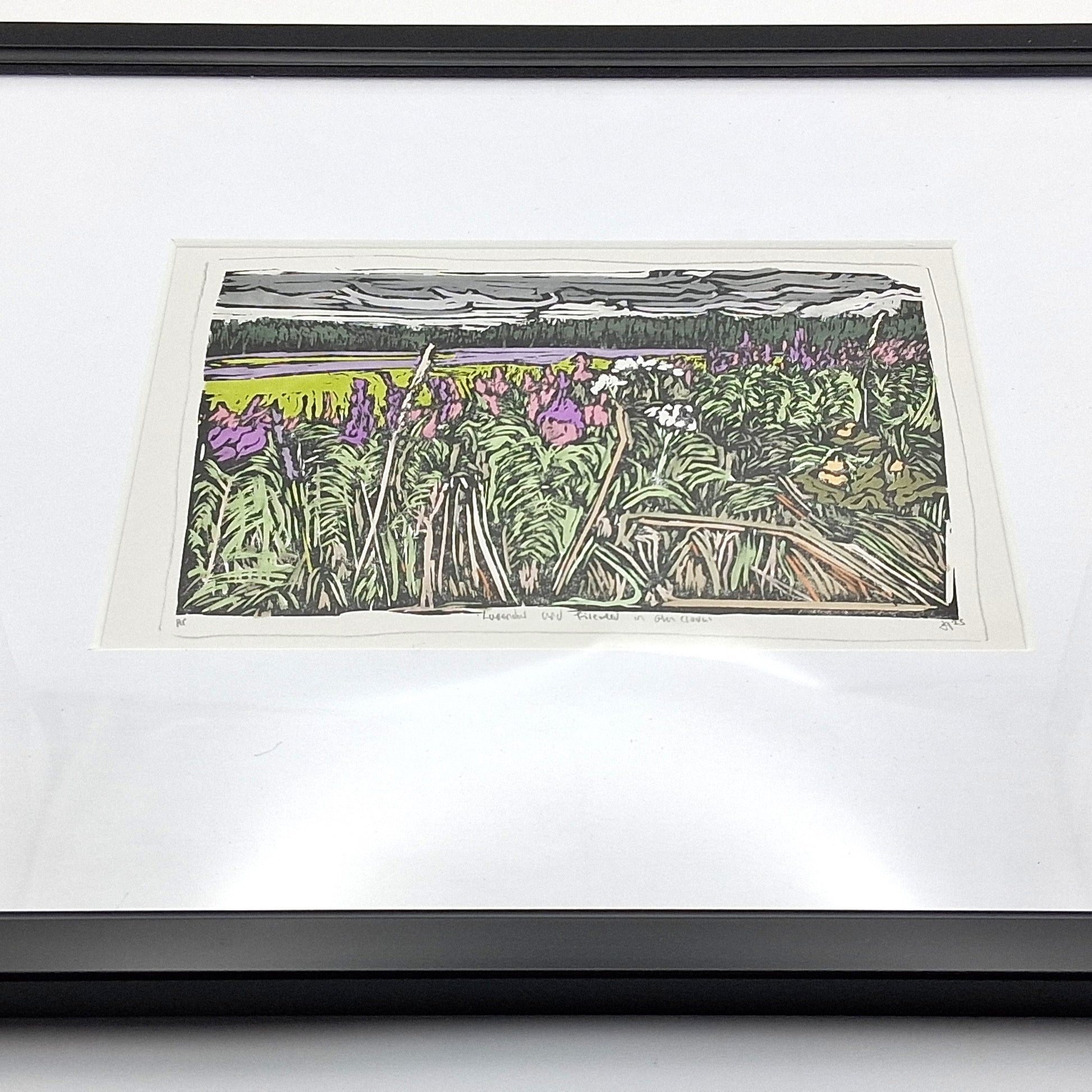 A colourful linocut print by BeeBirds depicting a scenic view of Glen Clova in Angus, highlighting lavender and fireweed, mounted in a black frame.