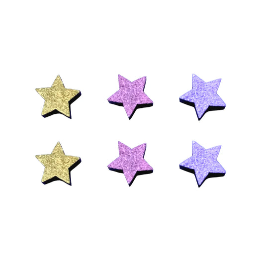 A set of six mini star-shaped studs in gold and purple colors, with a glittery finish.