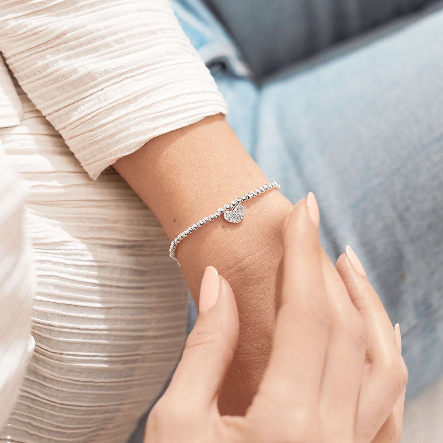 Silver plated 'Special Daughter' Joma Jewellery heart charm bracelet worn on wrist