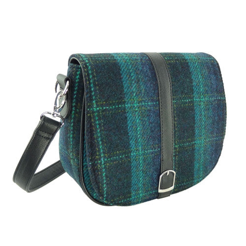 Classic compact shoulder bag made from genuine Harris Tweed wool, featuring a zip closure, adjustable strap, and faux leather trim.