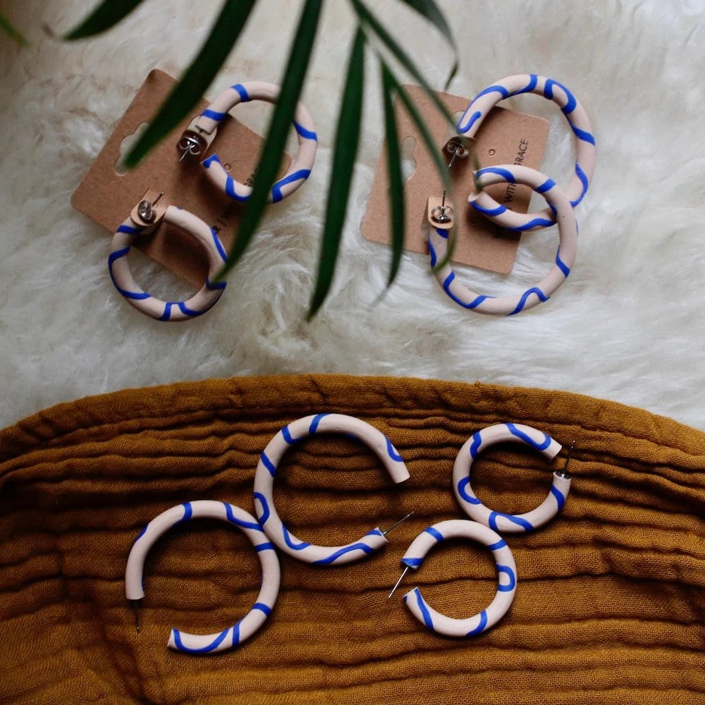 Handmade wavy polymer clay hoop earrings in bold colour combinations, lightweight statement hoops with hypoallergenic steel fittings.