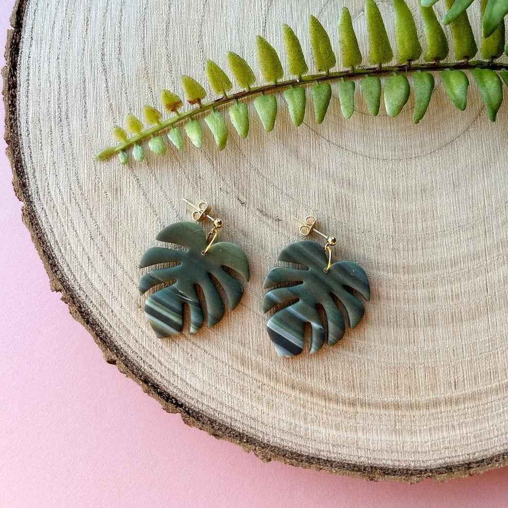 Green polymer clay monstera leaf earrings with gold-plated posts, lightweight and perfect for adding a tropical touch