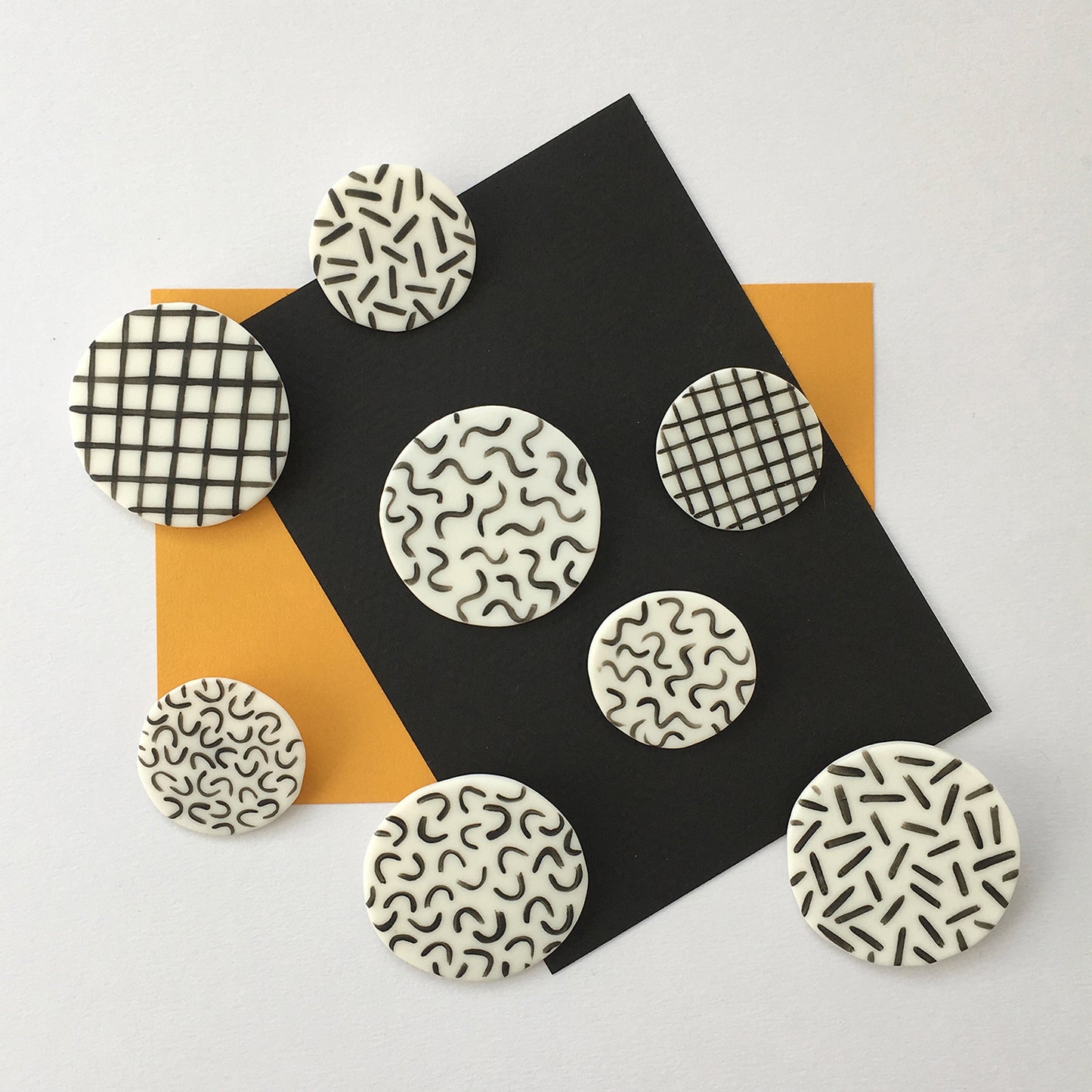 STAPLE BROOCH PIN GRID