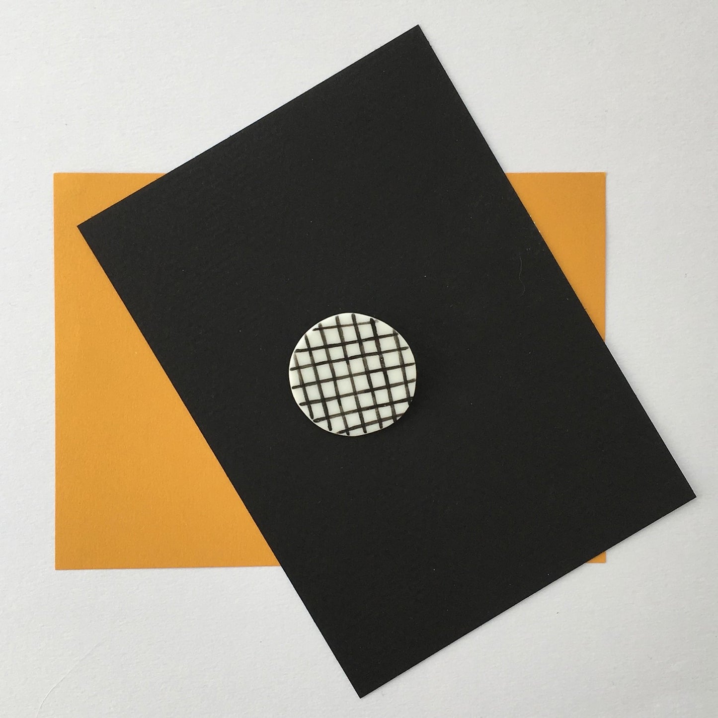 STAPLE BROOCH PIN GRID