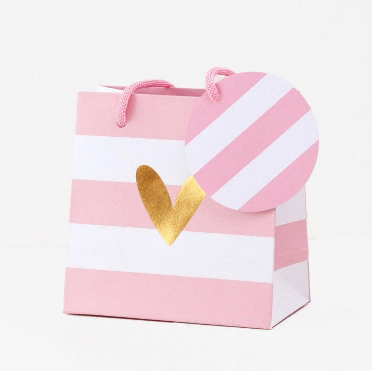 Pink and white striped Belly Button small gift bag with rope handles, tag and gold heart