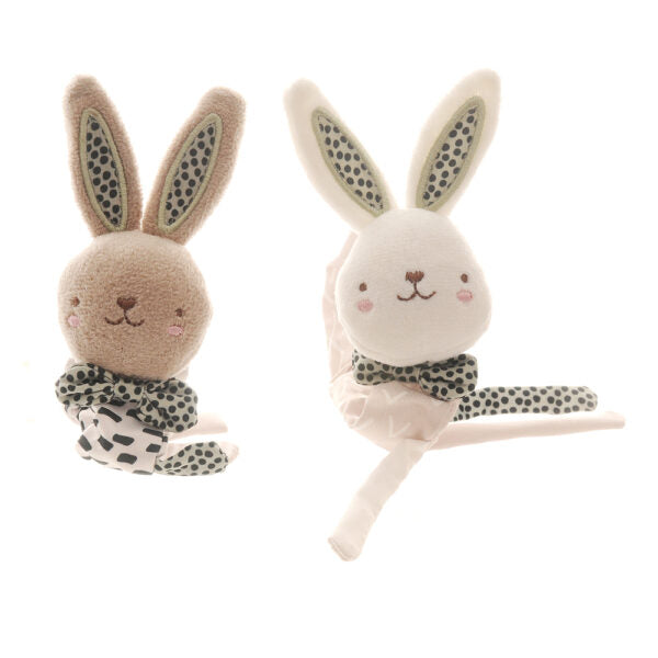 Set of two soft baby rabbit wrist rattles, one white and one beige, with green, black and white patterns.