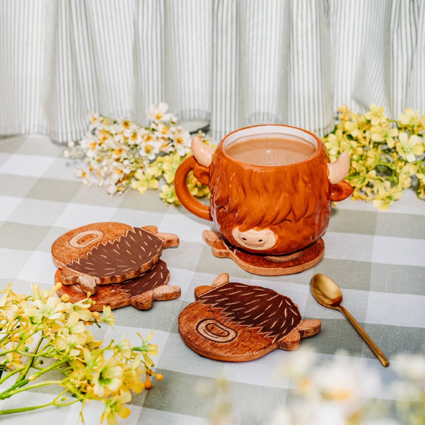 Set of 4 wooden Highland cow coasters from the Farmyard collection with rustic country charm.